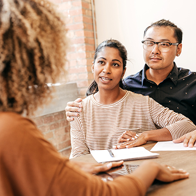 Young couple applying for health care service financial assistance