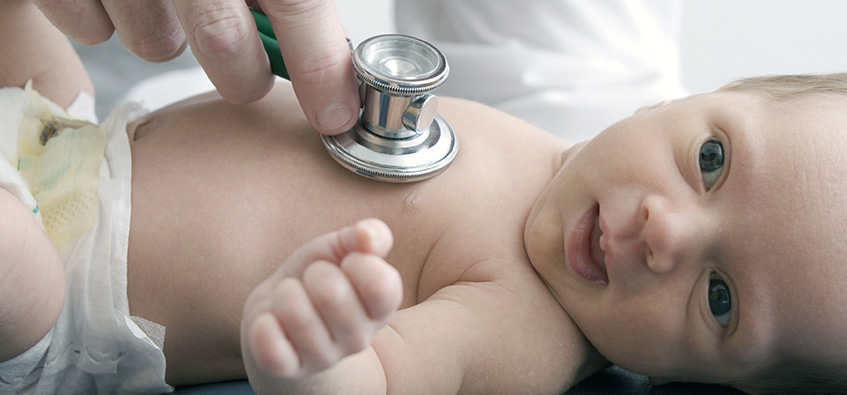 Pediatric doctor examines infant with larynomalacia