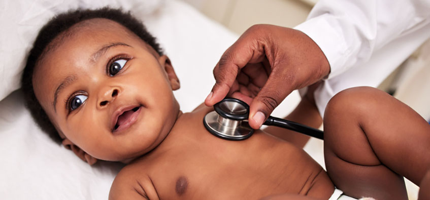 Doctor examines child with biliary atresia