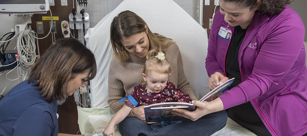 nurse with child and family