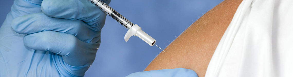 Closeup of patient receiving a flu vaccine injection at Beaumont