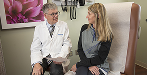 Physician speaks to female patient