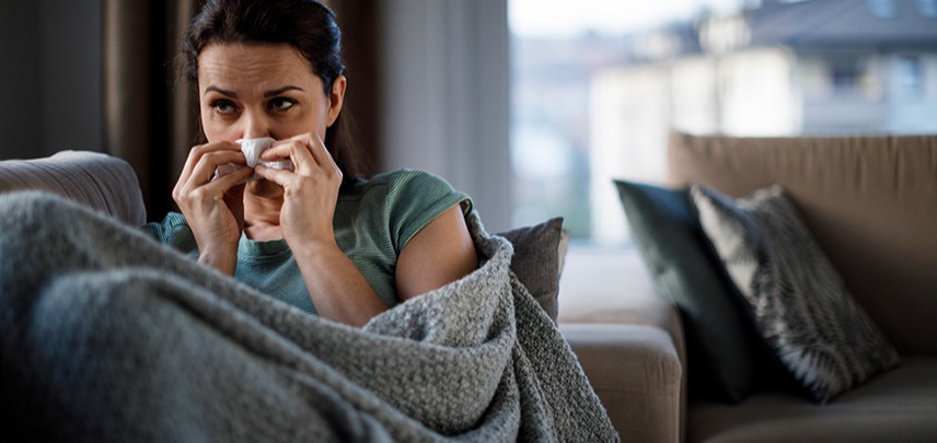 Girl on couch suffering from sinusitis