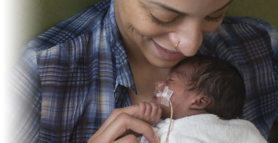 Mother holds her newborn baby at Beaumont