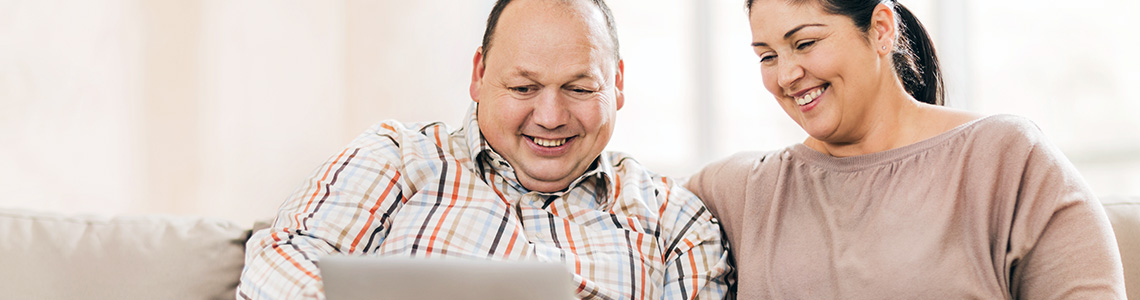 Happy couple setting up their myBeaumontChart account