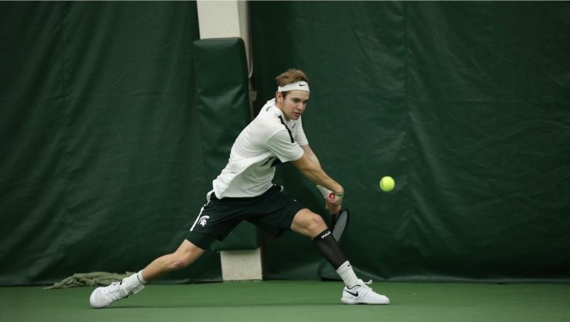 Jack playing tennis at MSU