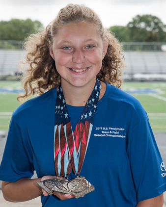 Margaret Beaudoin with Paralympics medals