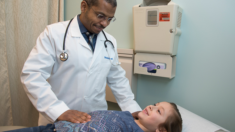 Dr. Osman with pediatric patient